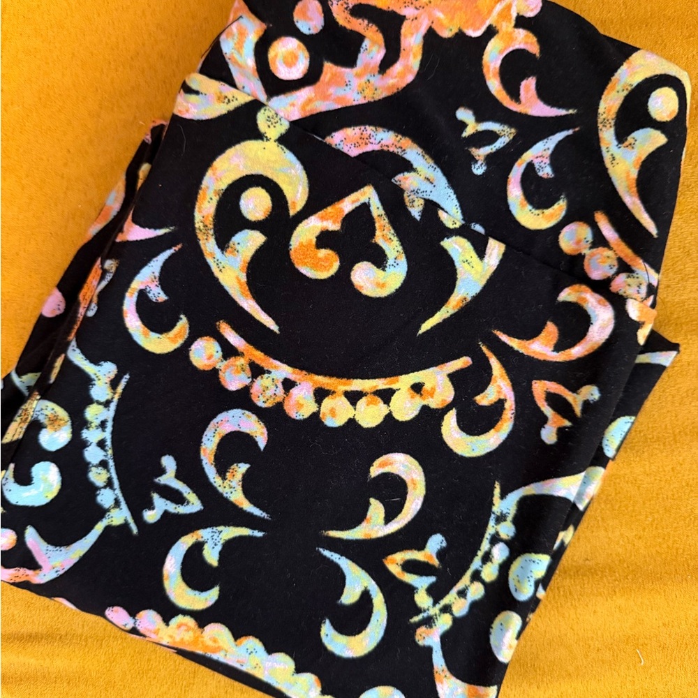 LuLaRoe Black Leggings with Pastel Multi-Color Scroll Print